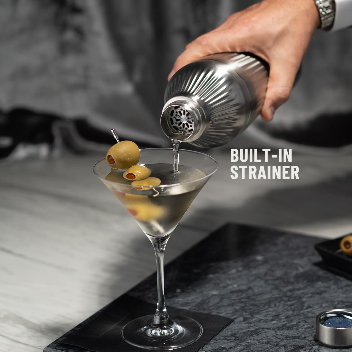 Elevated Craft integrated strainer catching ice for cleaner pours