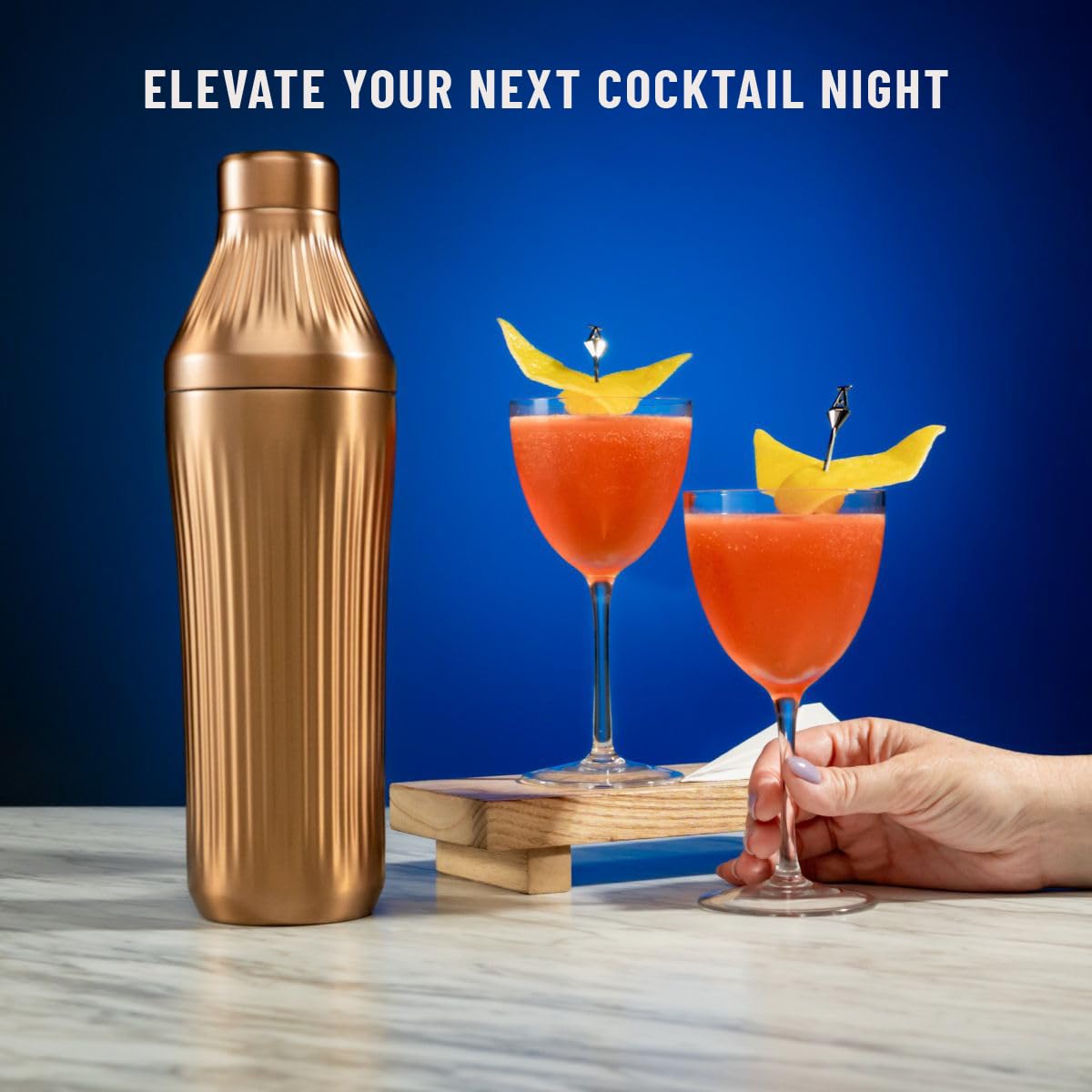 Elevated Craft next to a glass to illustrate 28 oz capacity and scale for serving sizes