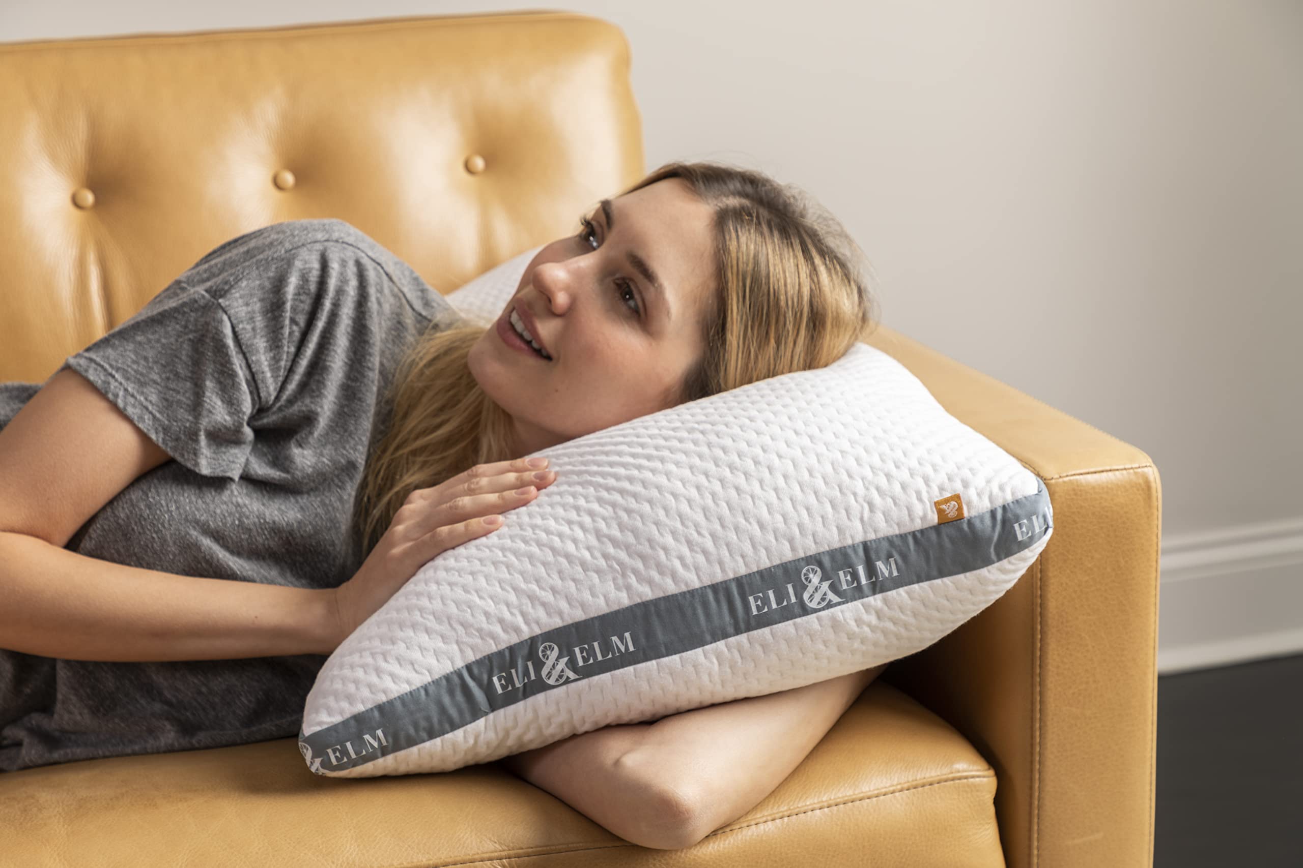 Eli & Elm queen pillow on bed with ruler depicting scale and correct shoulder fit