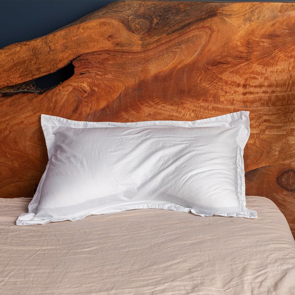 Eli & Elm U-shape pillow on mattress showing shoulder support and alignment benefit
