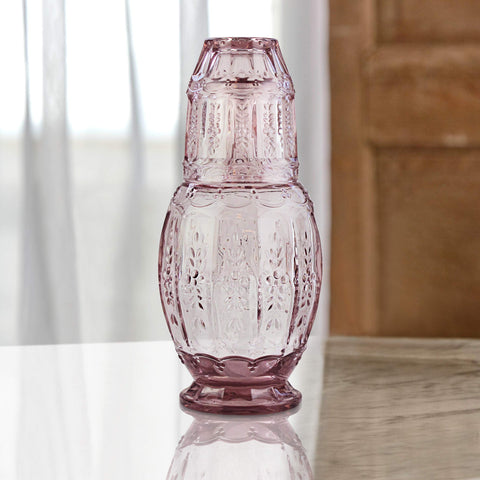 Elle Decor tumbler placed on carafe as lid demonstrating tidy bedside storage