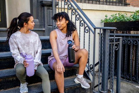 Ello Cooper on outdoor table conveying active lifestyle hydration benefits