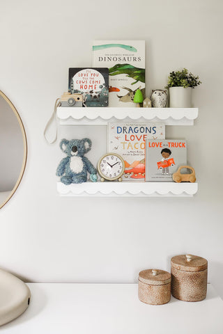 Elmwood Road shelves holding children’s books for easy access and learning
