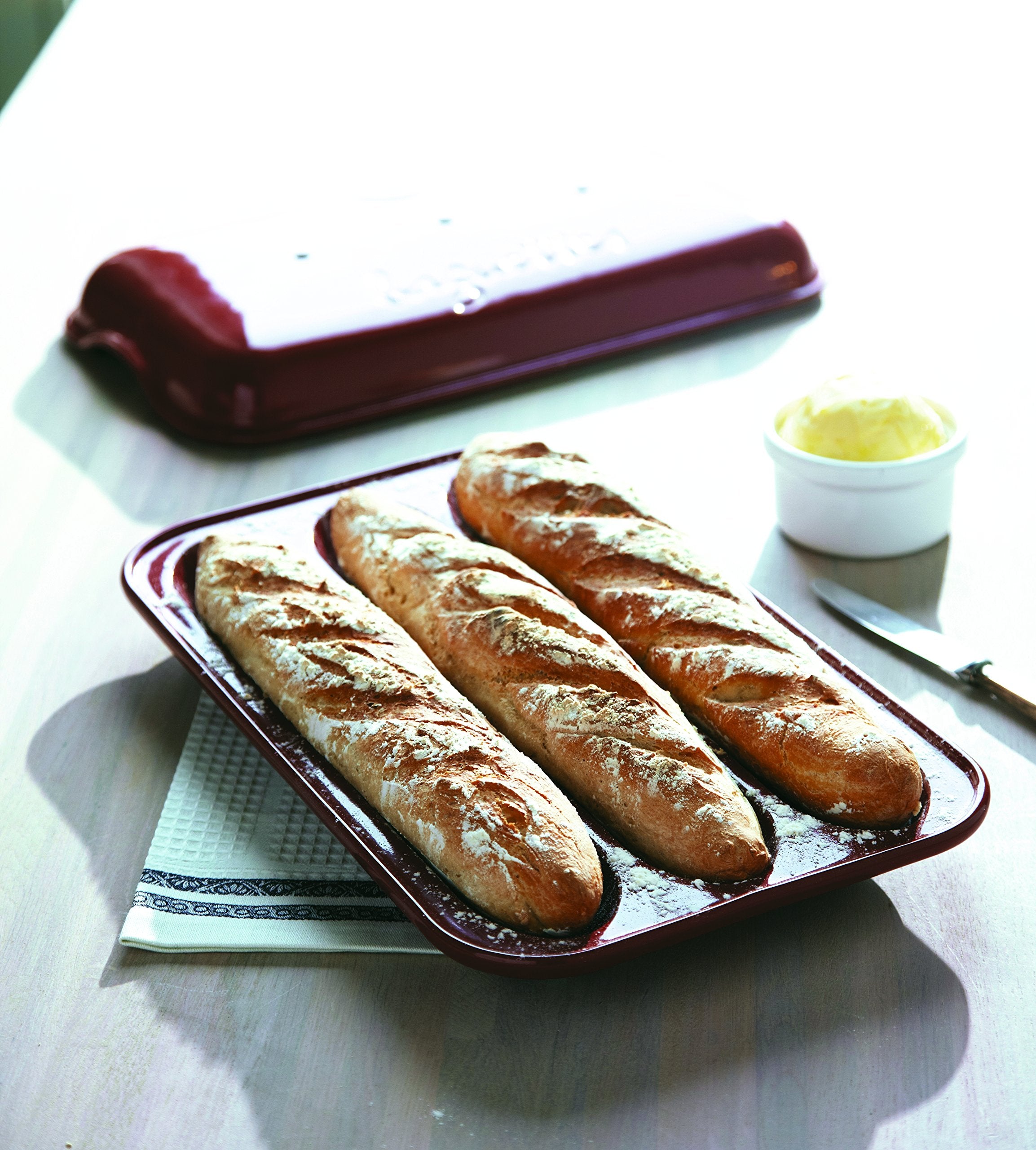 Emile Henry baguette baker next to ruler showing dimensions for oven fit and portion sizing