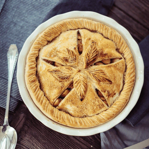 Emile Henry pie dish with baked pie inside demonstrating even browning and serving-ready look