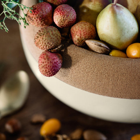 Emile Henry bowl on kitchen counter next to common items showing size and scale
