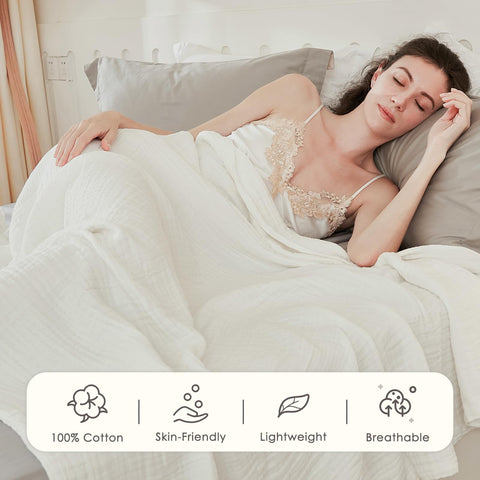 EMME draped on queen bed providing lightweight layered warmth