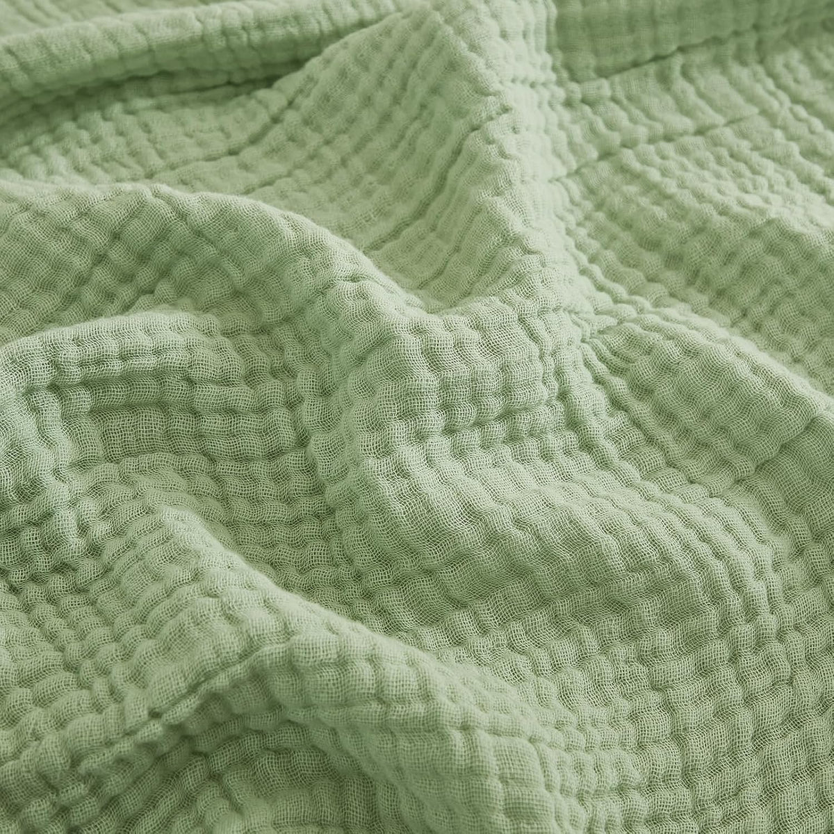 EMME sage green blanket front view showing soft breathable cotton