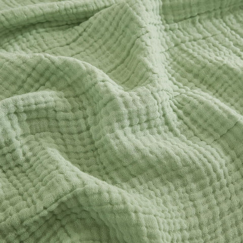 EMME sage green blanket front view showing soft breathable cotton