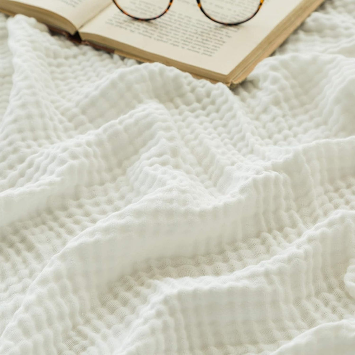 EMME blanket full drape on bed showing soft, breathable comfort