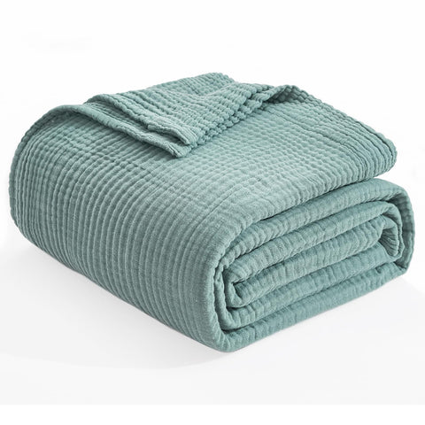 EMME blanket used outdoors on grass showing portability and multiuse convenience