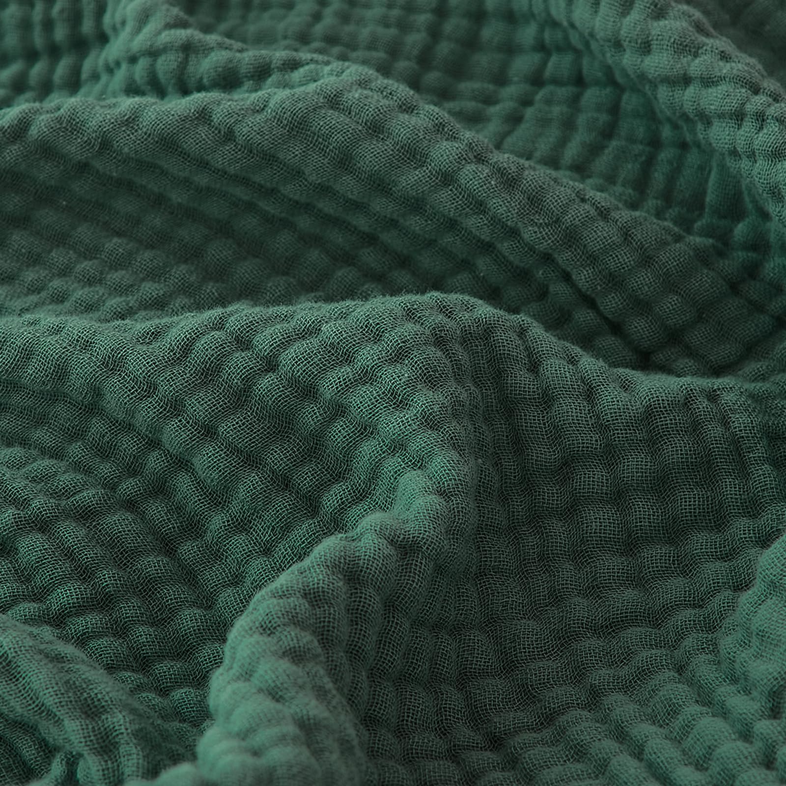 EMME front view forest green throw showing full size and calming color
