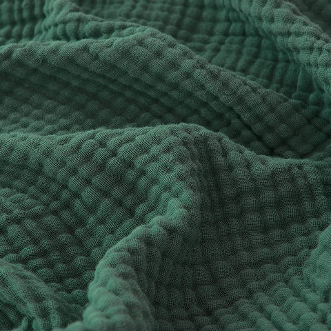 EMME front view forest green throw showing full size and calming color