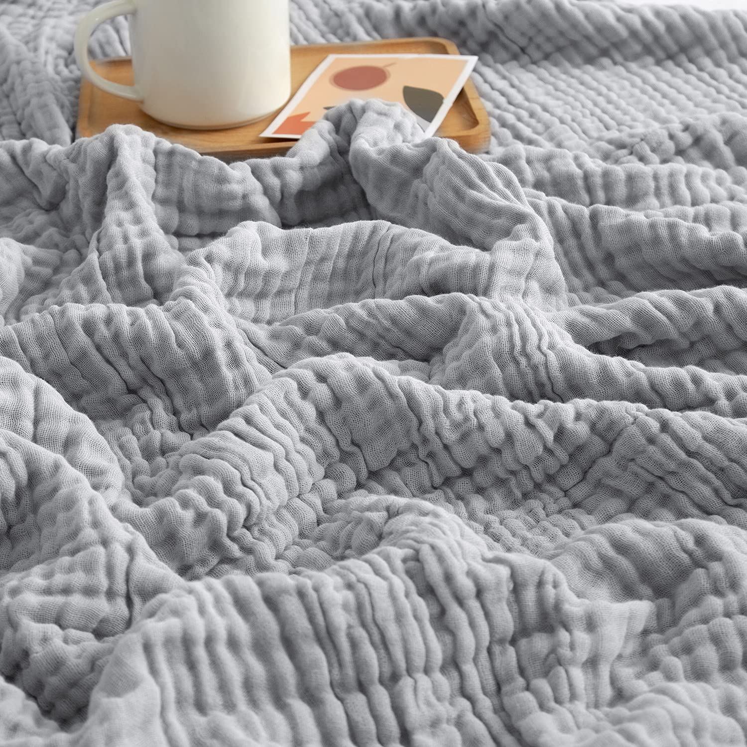 EMME folded blanket front view showing neat twin-size presentation and cozy appeal