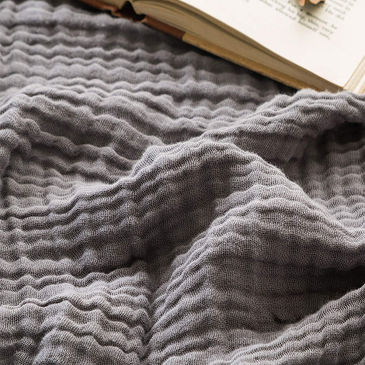 EMME front view of grey muslin throw showing neat edges and soft drape