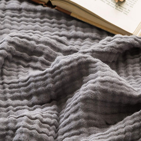 EMME front view of grey muslin throw showing neat edges and soft drape
