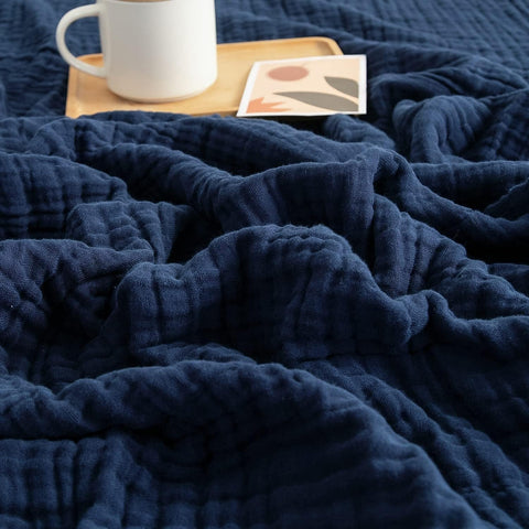 EMME navy throw front view showing full blanket and neat finish for versatile use