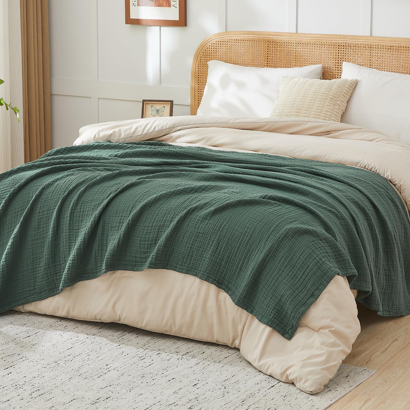 EMME throw layered on bed illustrating lightweight warmth and style