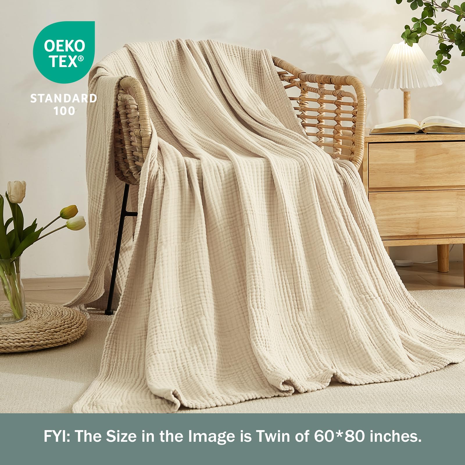 EMME blanket draped on couch showing cozy styling and living room use