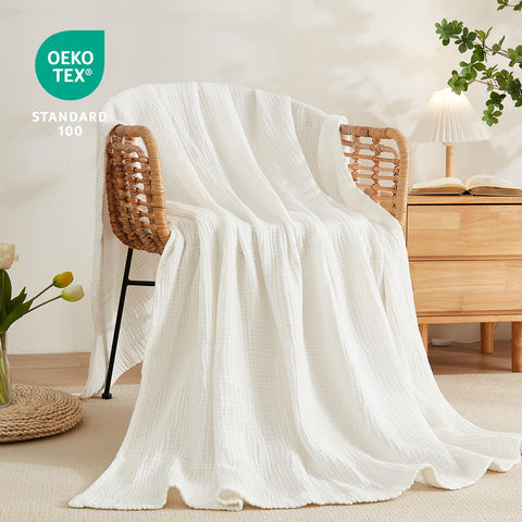 EMME on sofa styling adds decorative warmth and elevates room aesthetics