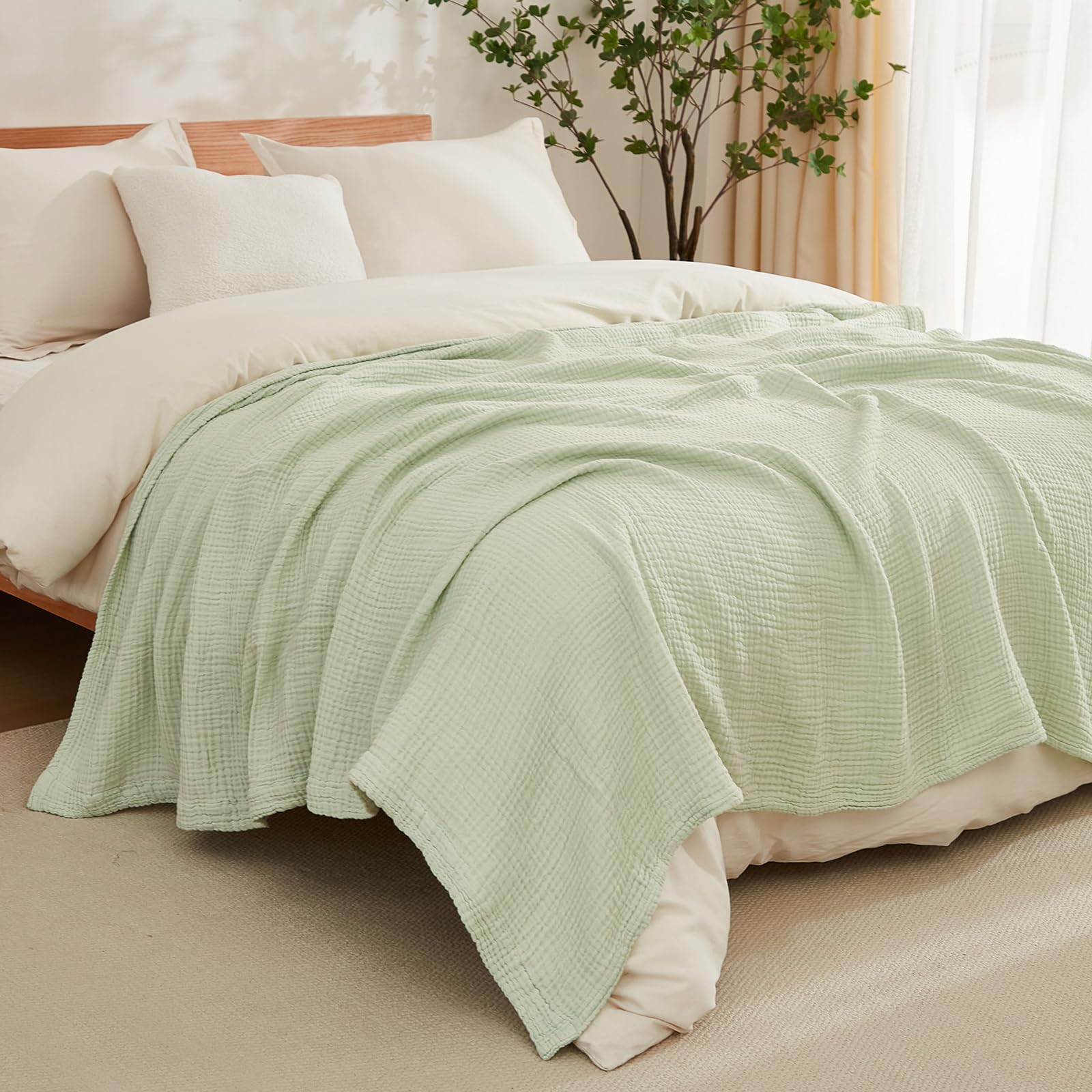 EMME blanket next to pillow showing 50x71 size for full adult coverage