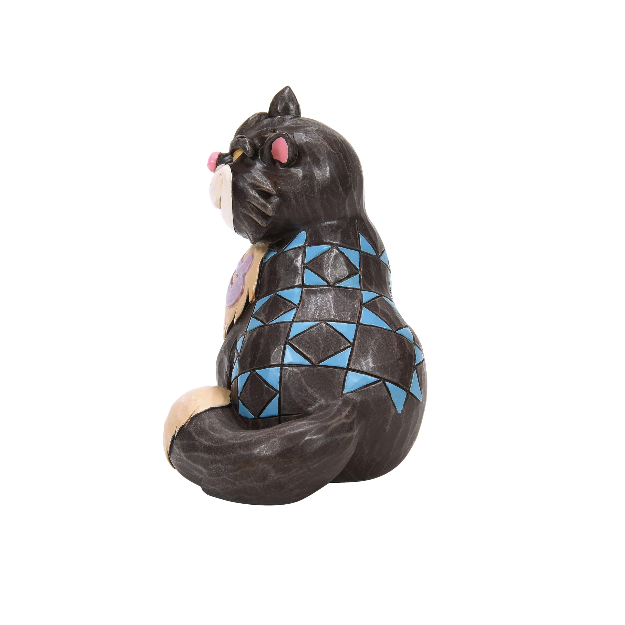 Enesco Jim Shore Lucifer on shelf as part of a Disney collection, adds personality