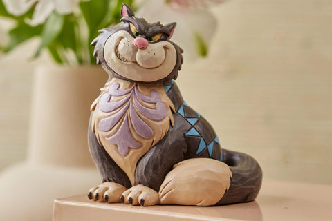 Enesco Jim Shore Lucifer side profile highlighting sculpted posture and charm