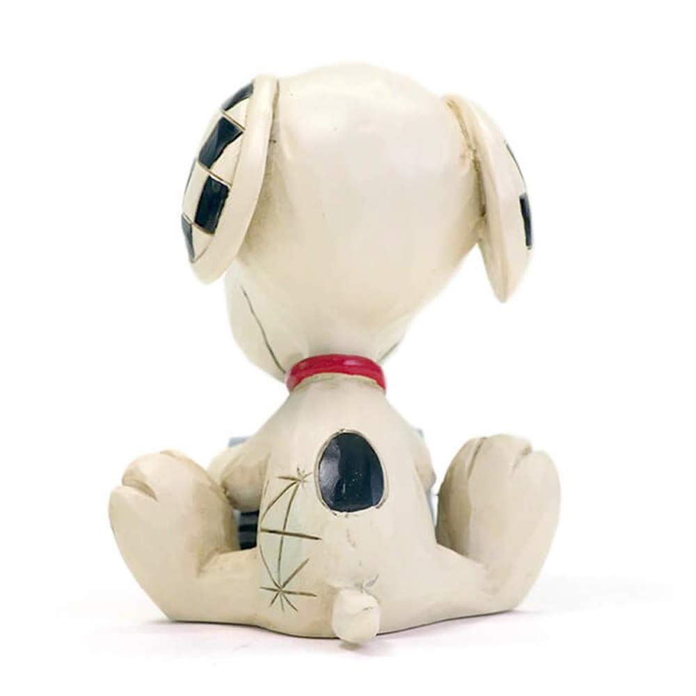 Enesco Jim Shore Snoopy on a display shelf showing how it accents collections