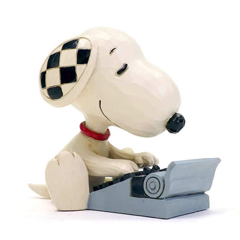 Enesco Jim Shore Snoopy next to ruler illustrating compact size and space-saving benefit