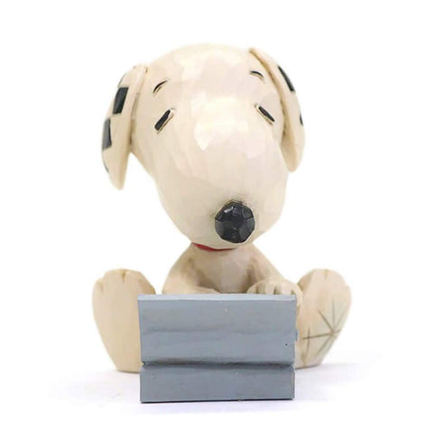 Enesco Jim Shore Snoopy typewriter detail emphasizing intricate carving and visual interest