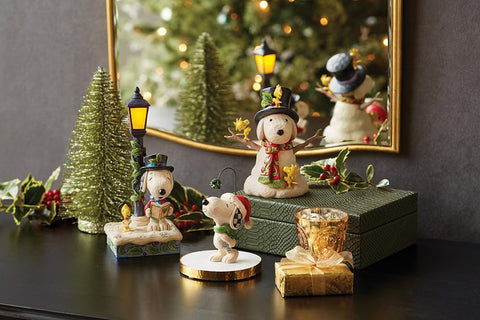 Enesco Snoopy in holiday lifestyle scene adding seasonal warmth to decor