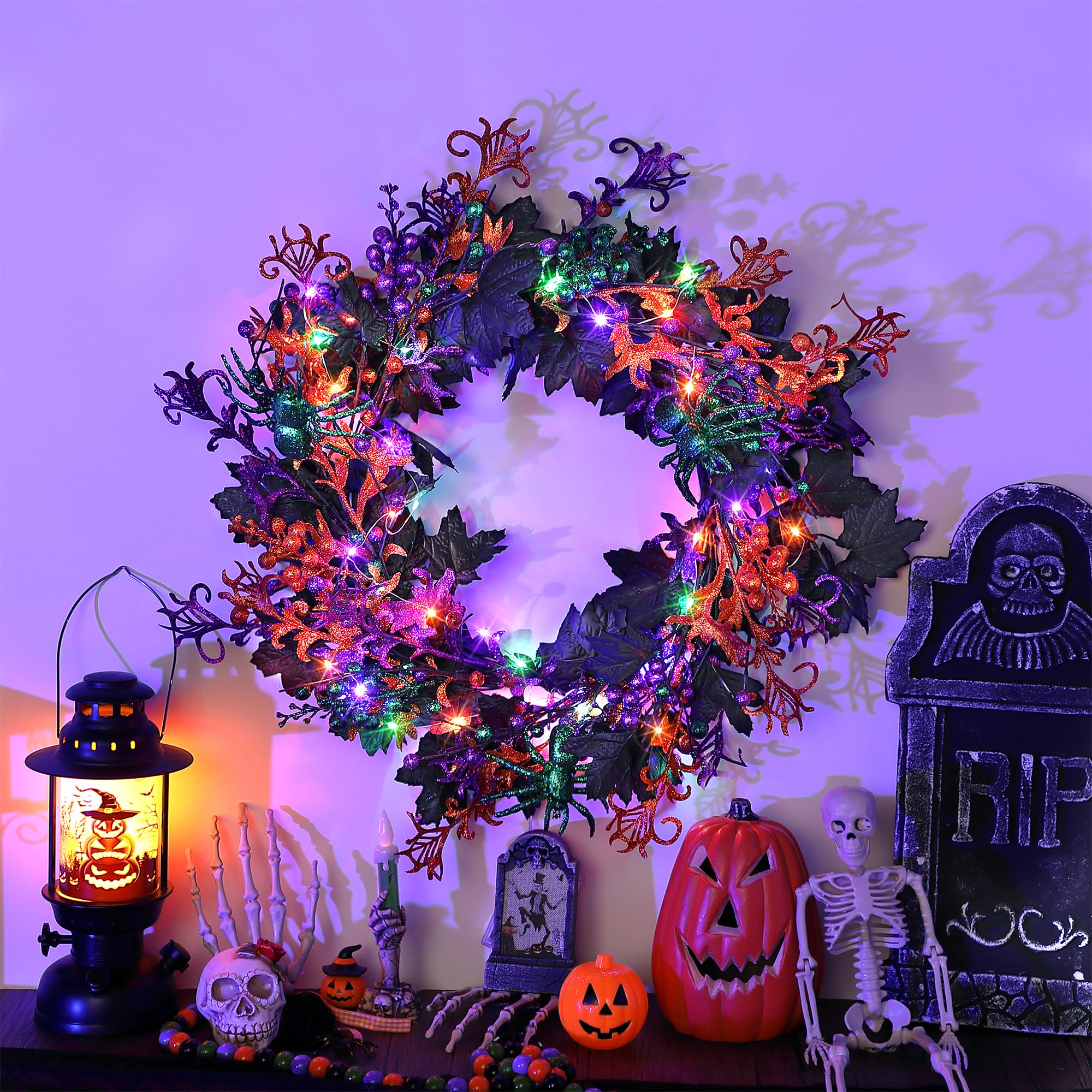 Enhon lit wreath on porch at night enhances Halloween atmosphere