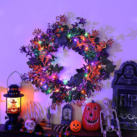 Enhon lit wreath on porch at night enhances Halloween atmosphere