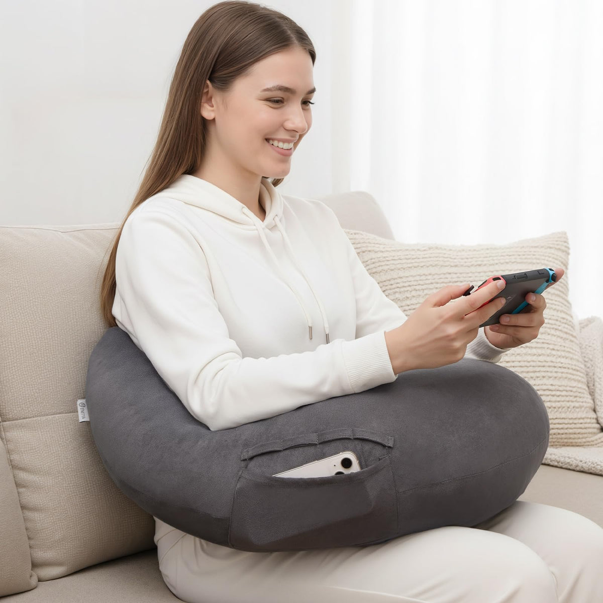 ENITYA front view showing pillow shape and wide lap surface for stable support