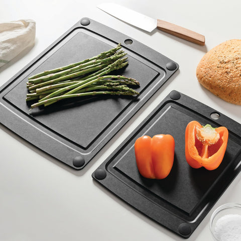Epicurean board next to chef knife shows scale and portable workspace benefit