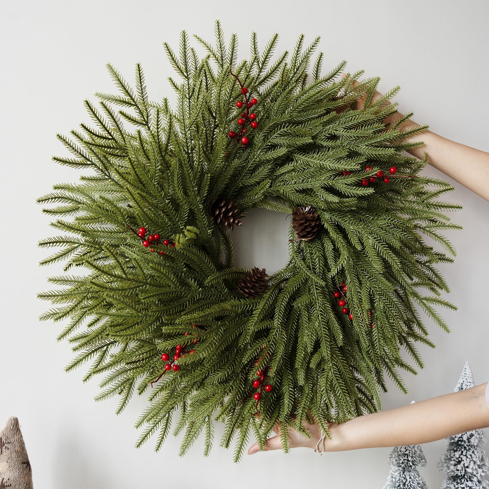 Eqanro red berries and pine cones detail adding seasonal contrast