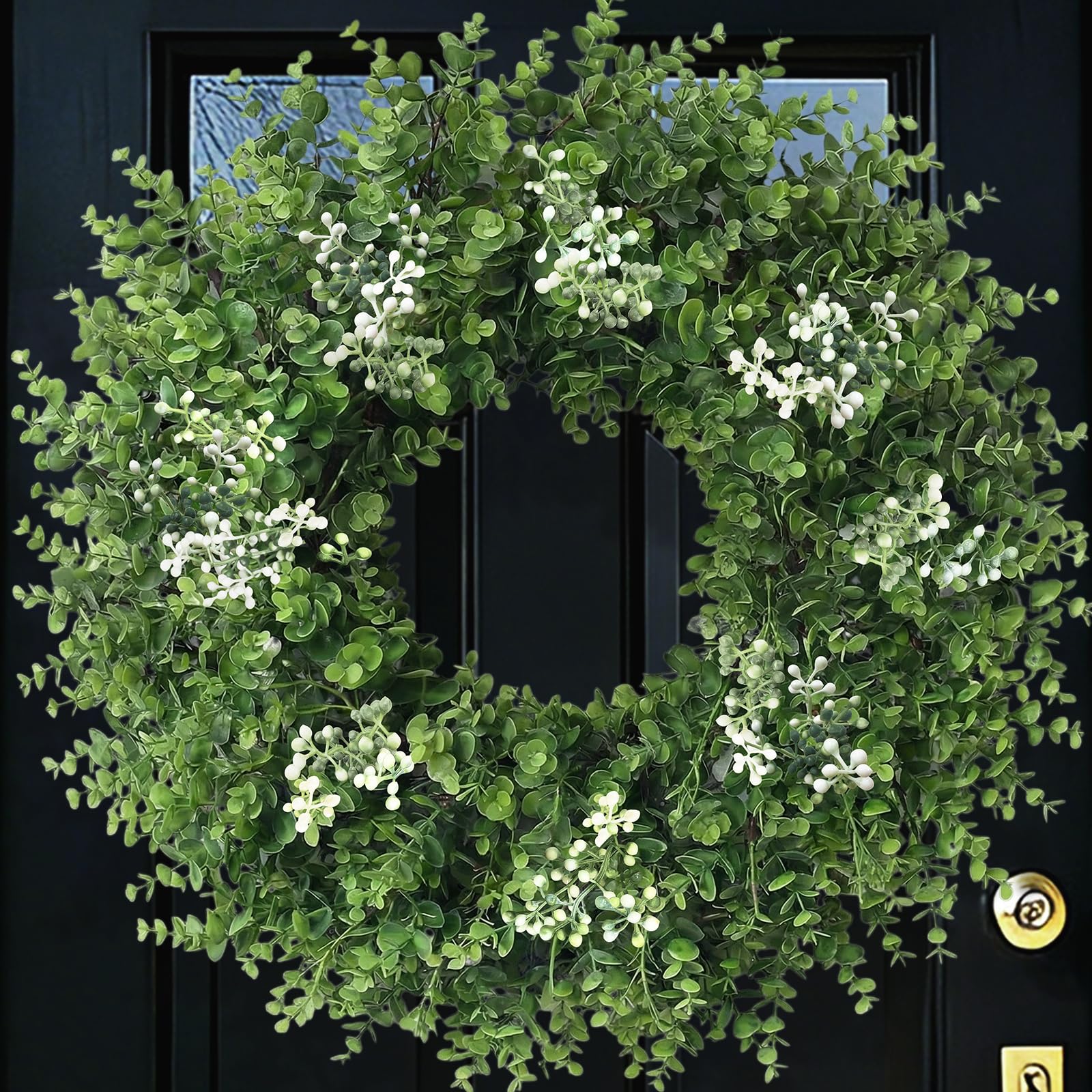 Eqanro front door wreath hung on entrance showing welcoming greenery