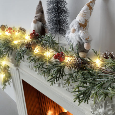 Eqanro garland lit on a mantel creating cozy holiday ambiance