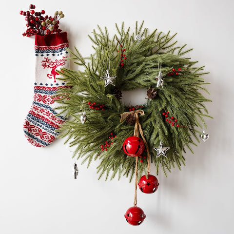 Eqanro wreath hung on a wooden front door adding farmhouse charm