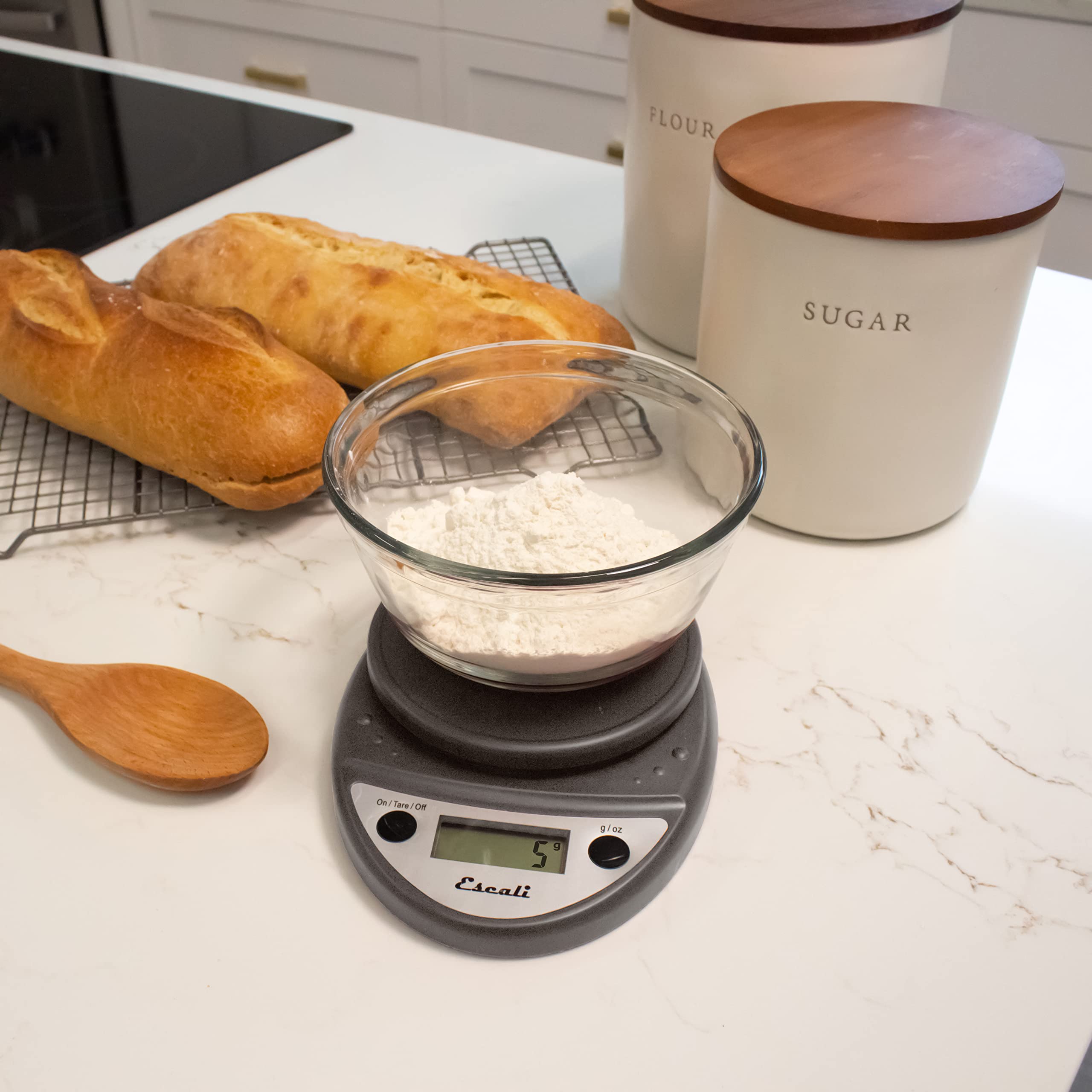 Escali Primo weighing baking ingredients in a bowl, enabling accurate recipe portions