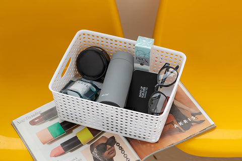 Eslite basket filled with pens and cords keeping office supplies orderly