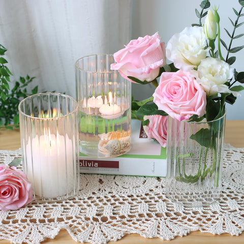 Etolies group of vases used as a wedding centerpiece providing cohesive table styling