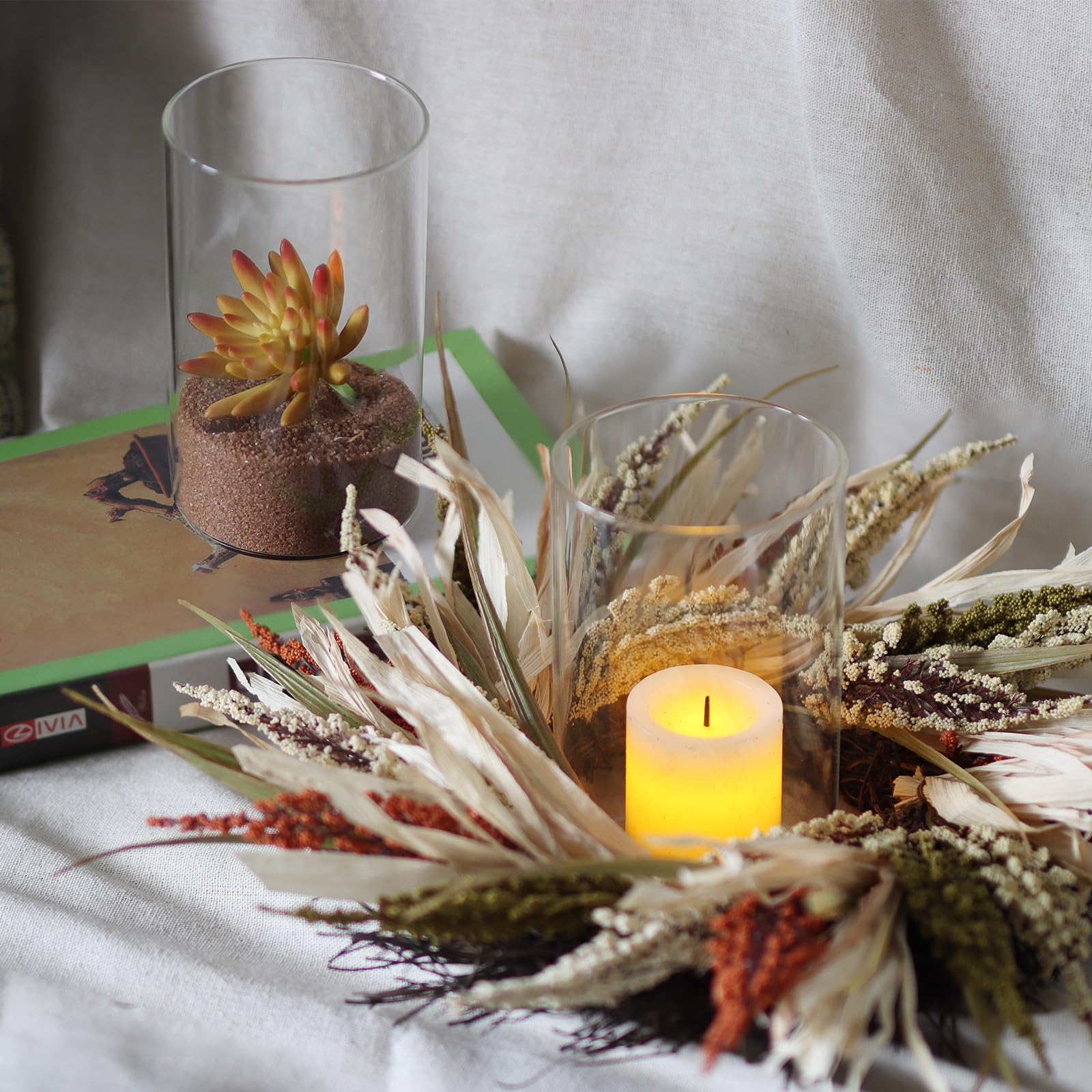 Etolies vases used as hurricane holders with floating candles adding ambiance