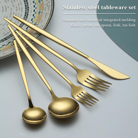 Evanda gold flatware arranged on a dressed table for wedding ambience