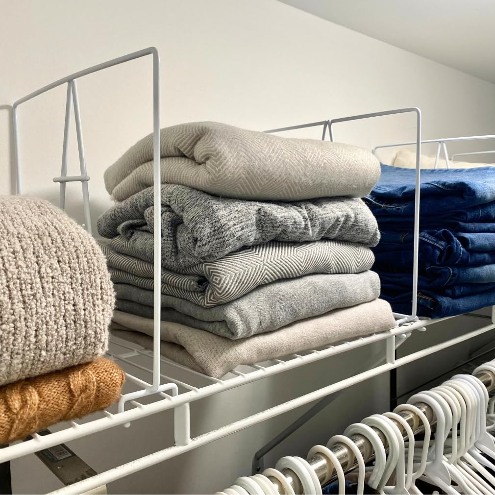 Evelots divider beside folded sweaters showing 10.75-inch height support benefit