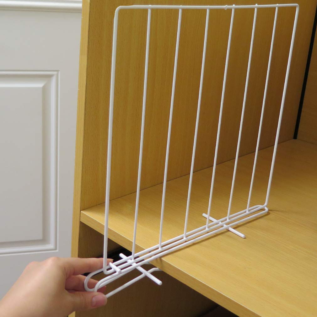Evelots creating sections in linen closet demonstrating neat towel and sheet storage