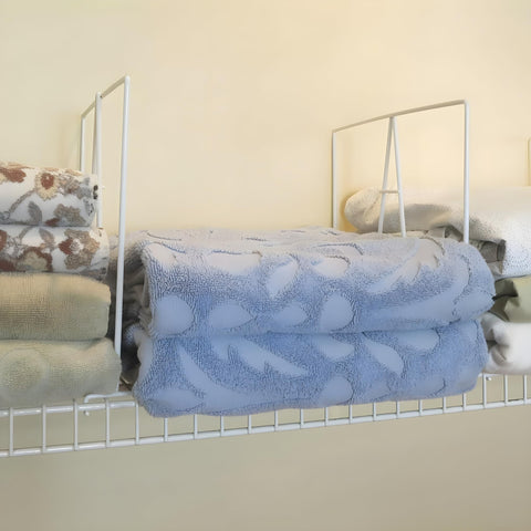 Evelots separating storage bins to prevent shifting and spills