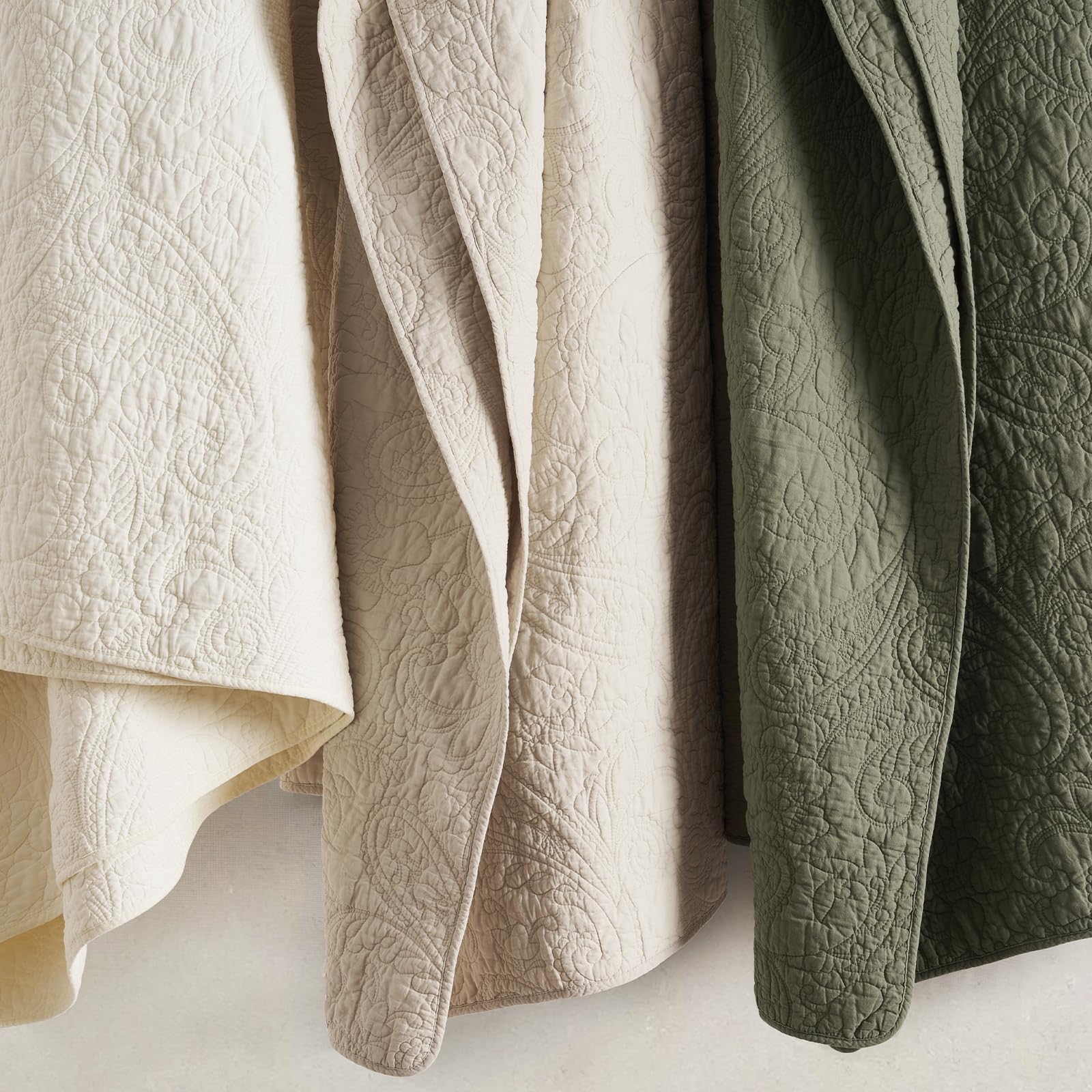 EverGrace quilt in bedroom setting showing calming olive color and style