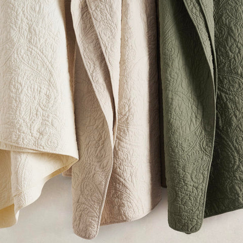 EverGrace quilt in bedroom setting showing calming olive color and style