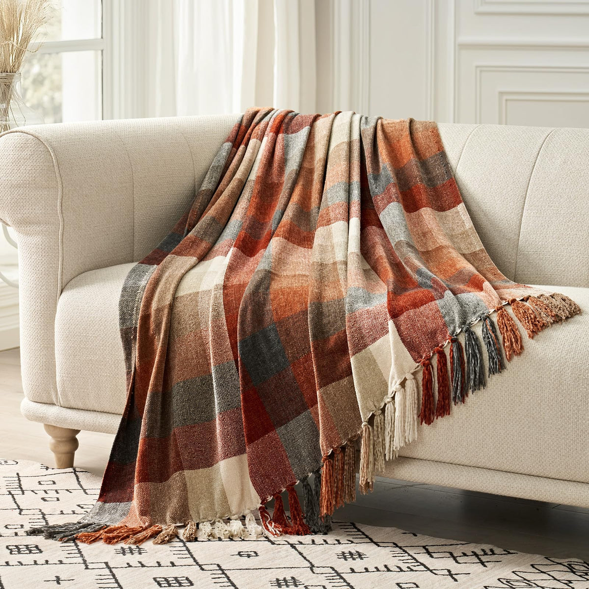 EverGrace folded harvest orange throw front view showing pattern and neat folds benefit: instant décor upgrade